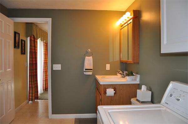 24 1/2 Mason Road Dudley, MA 01571 - Photo 15 of 30 a bathroom with a sink and a mirror