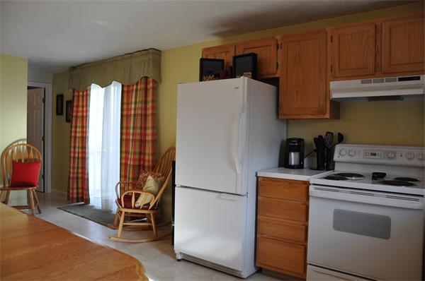 24 1/2 Mason Road Dudley, MA 01571 - Photo 4 of 30 a kitchen with stainless steel appliances a refrigerator and a stove top oven