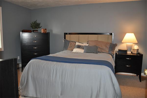 24 1/2 Mason Road Dudley, MA 01571 - Photo 9 of 30 a bedroom with a bed and a lamp