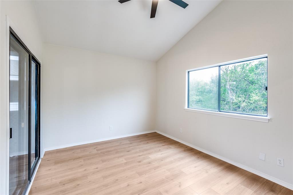 17490 Meandering Way, Unit 2202 Dallas, TX 75252 - Photo 20 of 24 Room featuring vaulted ceilings, wood-finish flooring, and a ceiling fan