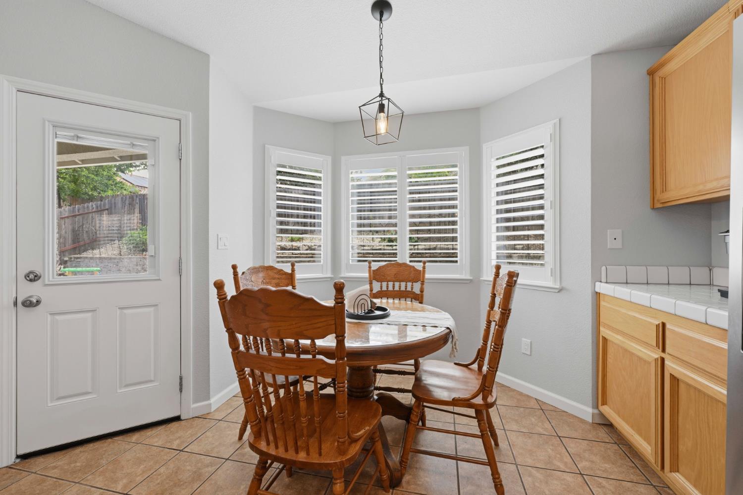 5013 Charter Road Rocklin, CA 95765 - Photo 15 of 35 a dining room with furniture and window