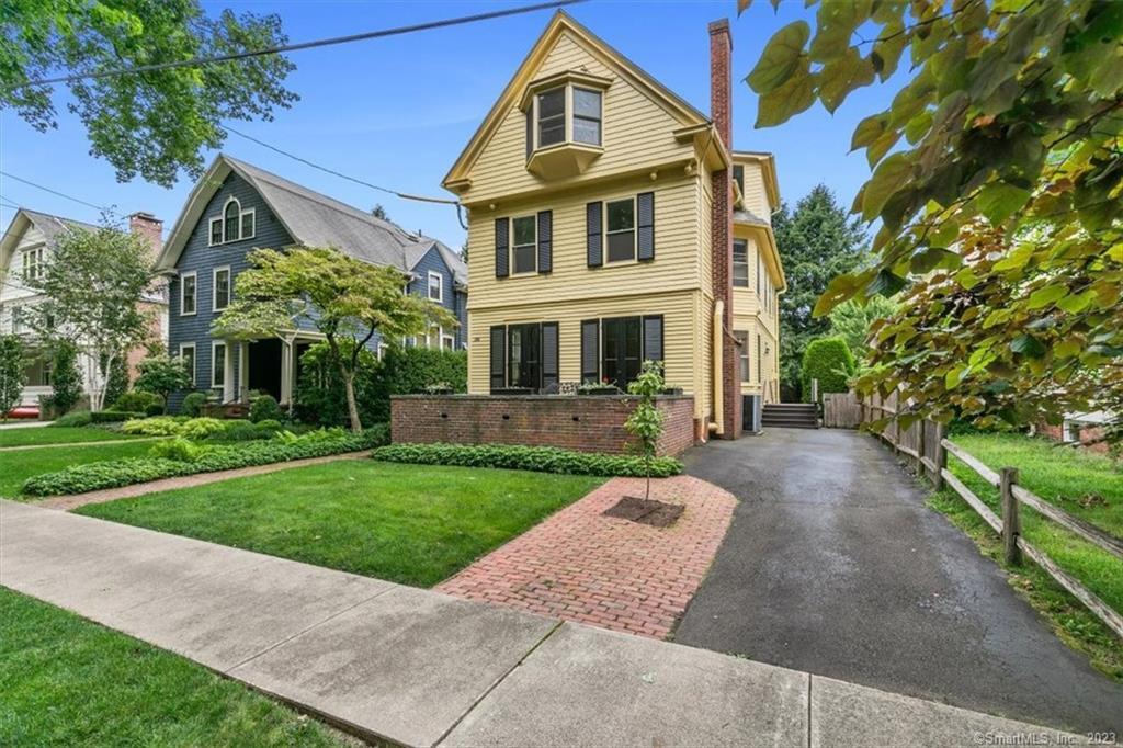 266 Everit Street New Haven, CT 06511 - Photo 2 of 21 a front view of a house with a yard and trees