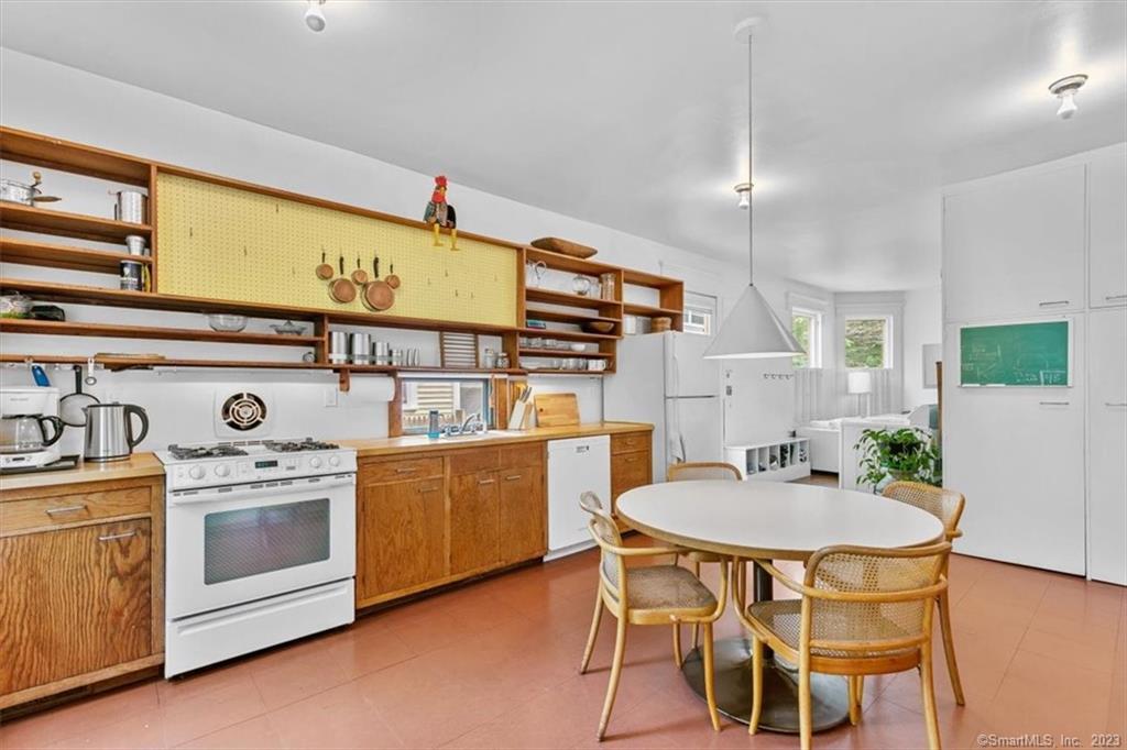 266 Everit Street New Haven, CT 06511 - Photo 7 of 21 a kitchen with a table chairs sink and cabinets