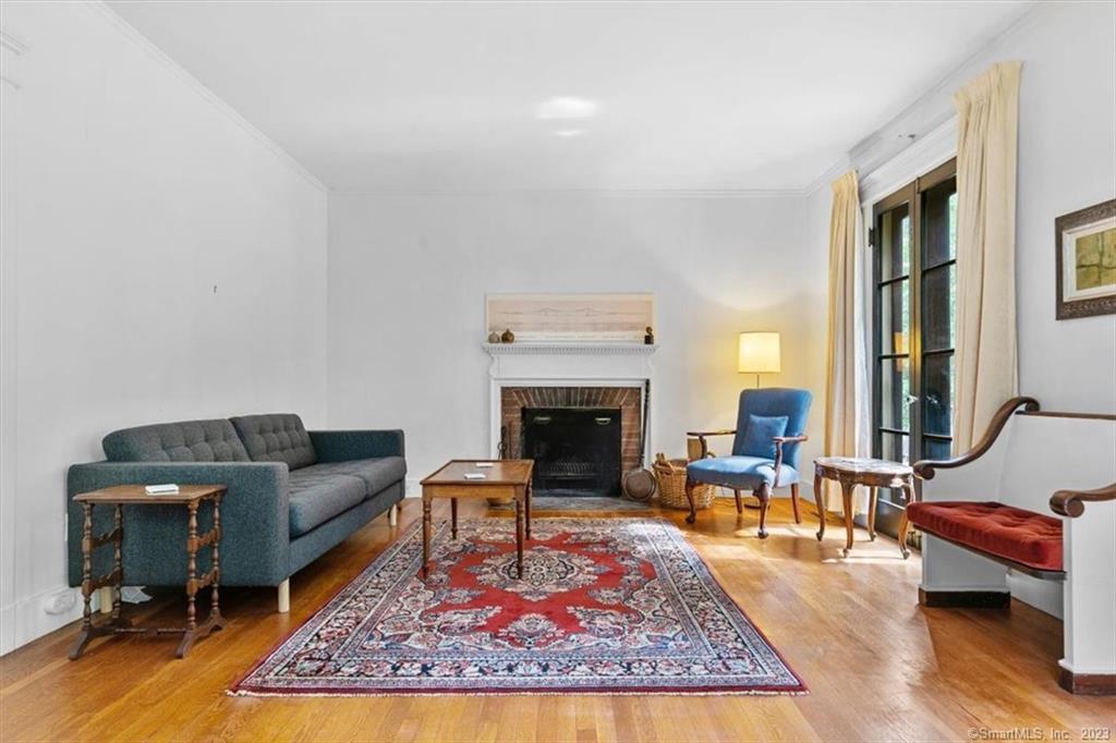 266 Everit Street New Haven, CT 06511 - Photo 8 of 21 a living room with furniture a rug a fireplace and a table