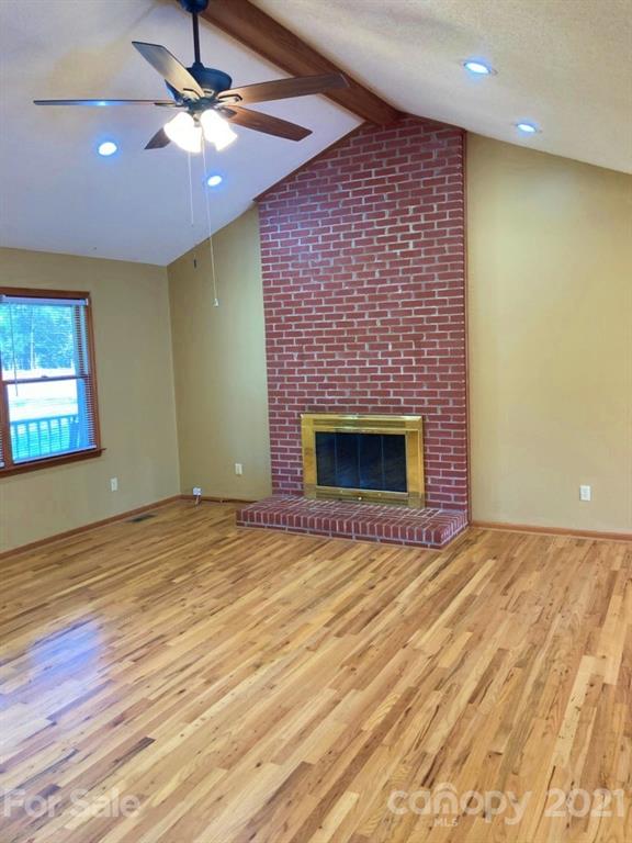 1091 South Beersheba Road Clover, SC 29710 - Photo 12 of 23 a view of an empty room with a fireplace