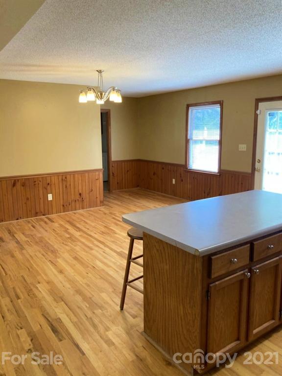 1091 South Beersheba Road Clover, SC 29710 - Photo 13 of 23 a room with table chairs and wooden floor