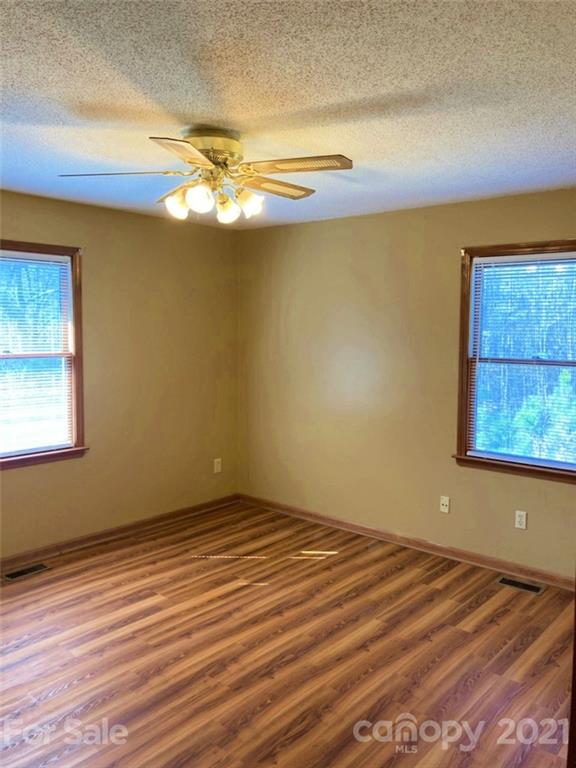 1091 South Beersheba Road Clover, SC 29710 - Photo 15 of 23 a view of empty room with wooden floor and fan