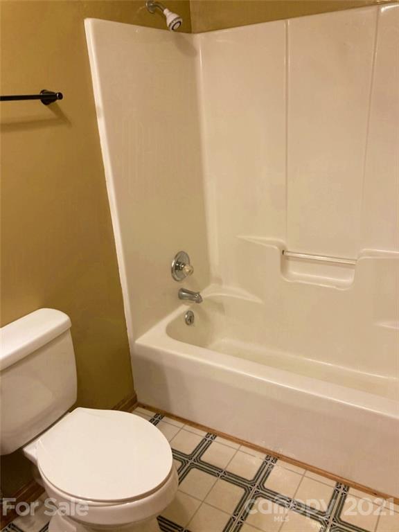 1091 South Beersheba Road Clover, SC 29710 - Photo 16 of 23 a white toilet sitting next to a bath tub