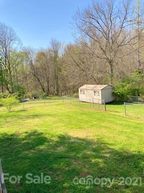 1091 South Beersheba Road Clover, SC 29710 - Photo 20 of 23 a view of a swimming pool with an outdoor space and seating area