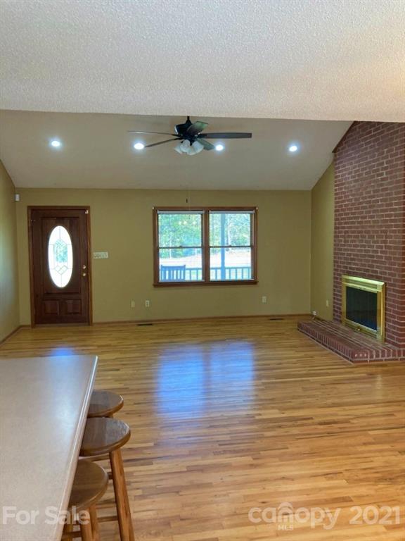 1091 South Beersheba Road Clover, SC 29710 - Photo 7 of 23 a view of empty room with wooden floor and fan