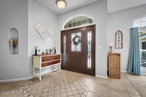 a view of a dining room with furniture wooden floor and chandelier
