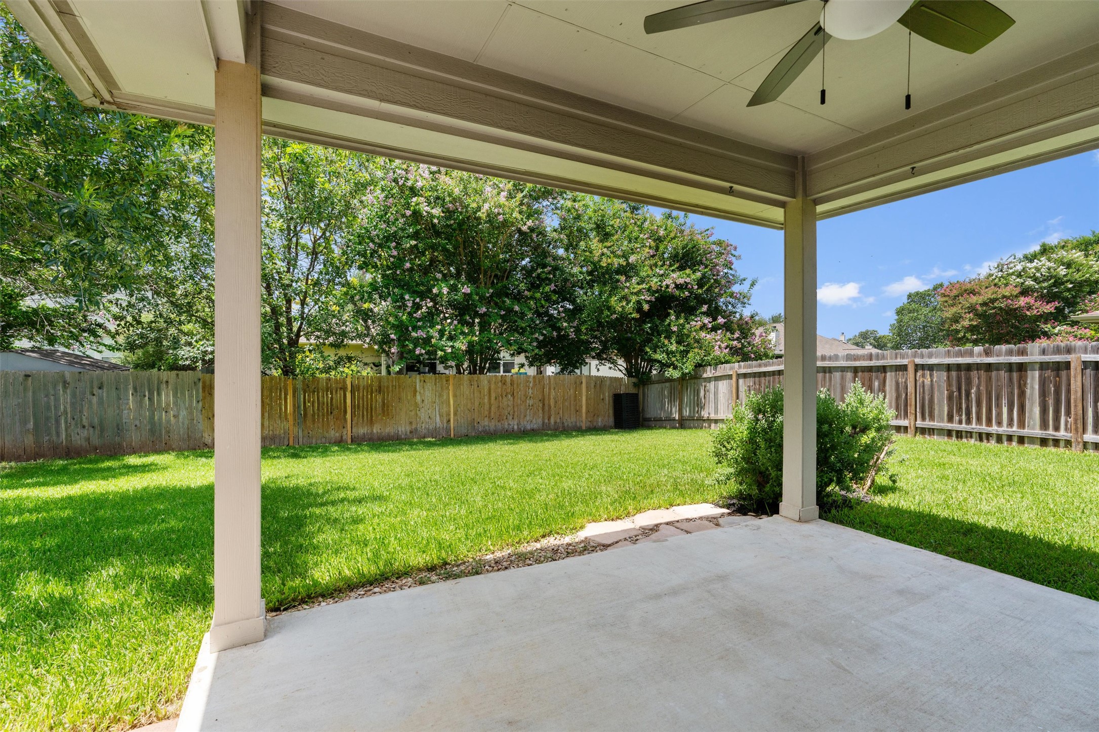 122 Copperwood Loop Round Rock, TX 78665 - Photo 21 of 40 The covered patio overlooks the well-manicured lawn.