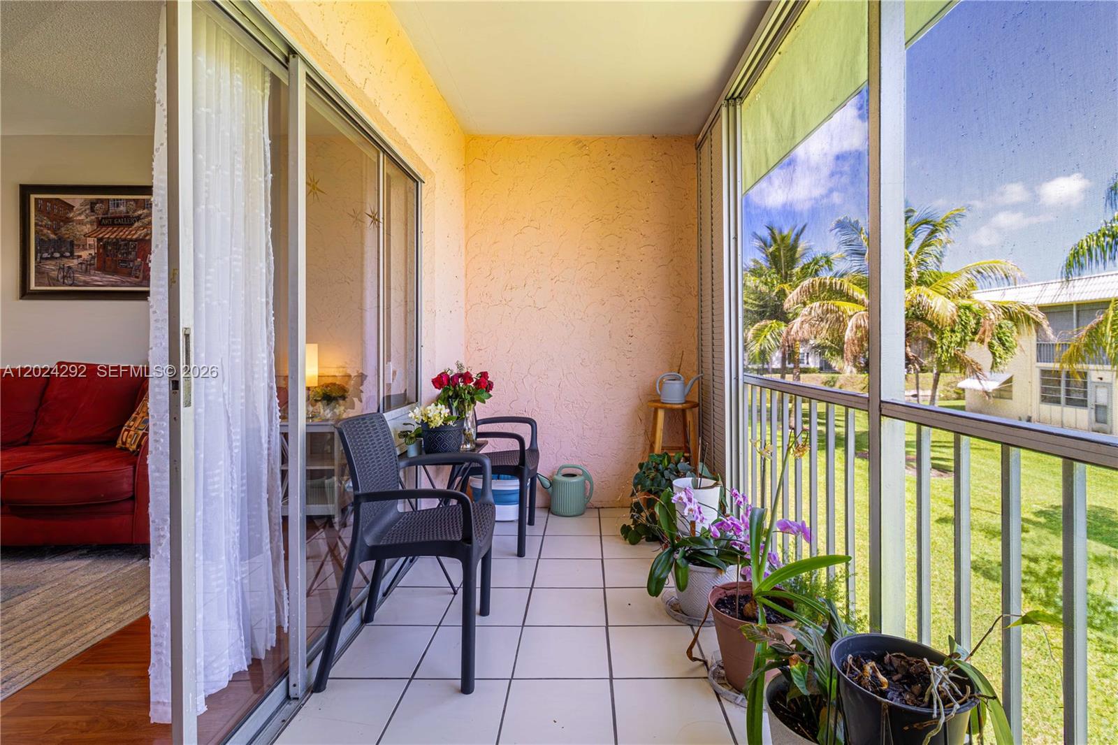 9780 Marina Boulevard, Unit 424 Boca Raton, FL 33428 - Photo 14 of 32 a view of a chairs and table in a living room