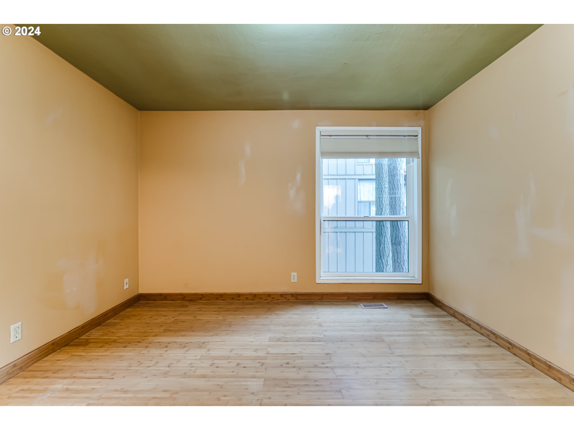 302 Woodcutter Way Eugene, OR 97405 - Photo 16 of 31 a view of wooden floor and windows in a room