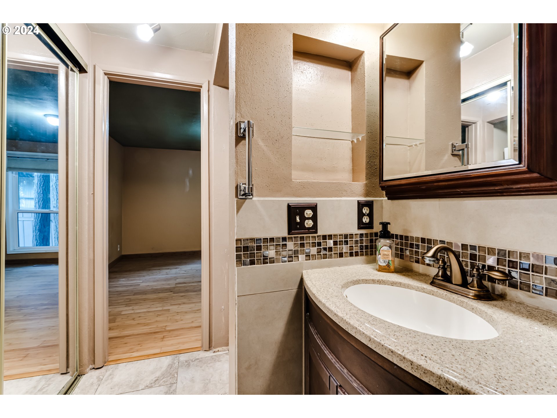 302 Woodcutter Way Eugene, OR 97405 - Photo 18 of 31 a bathroom with a sink and a mirror