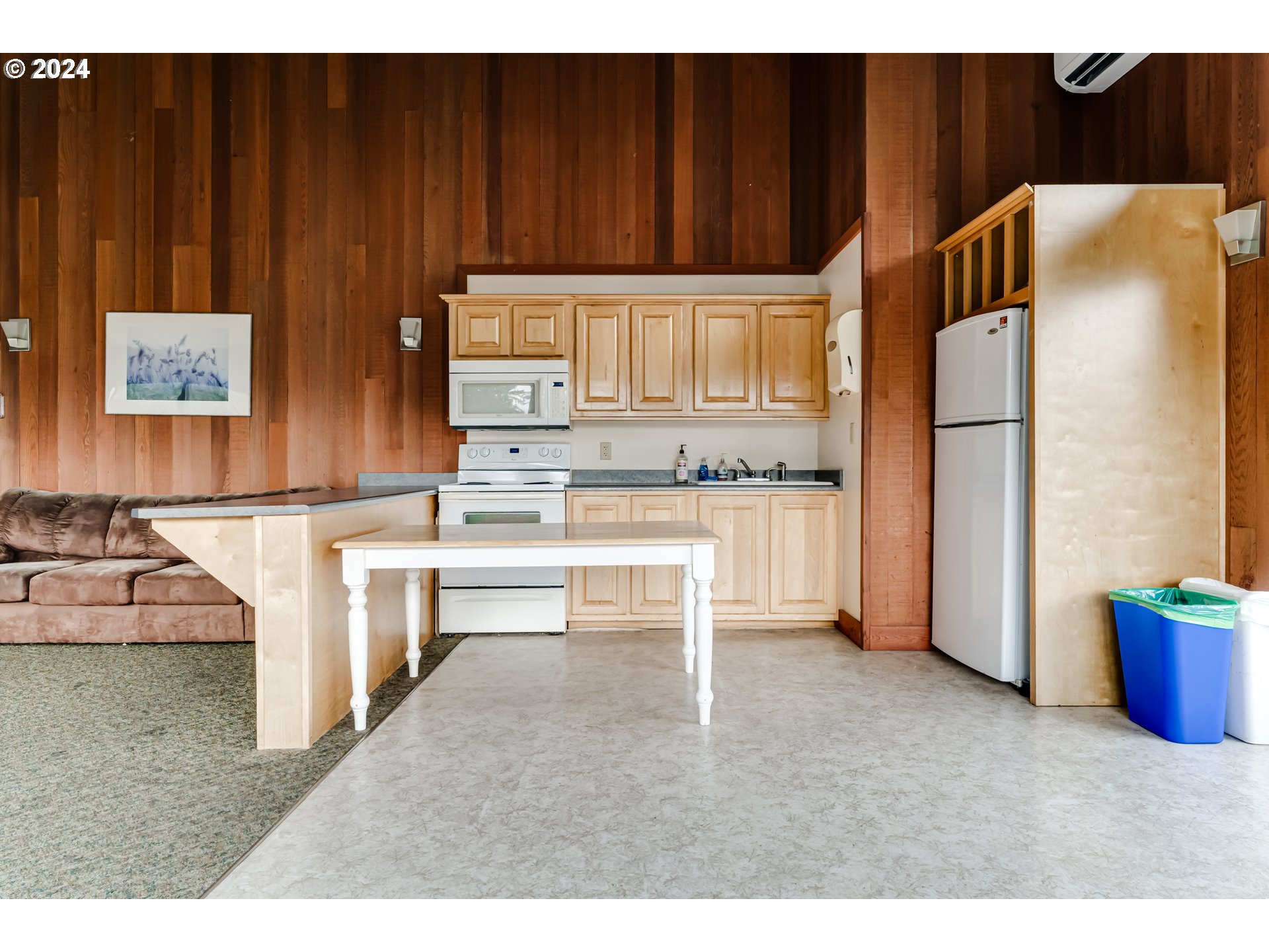 302 Woodcutter Way Eugene, OR 97405 - Photo 26 of 31 a kitchen with kitchen island cabinets and refrigerator