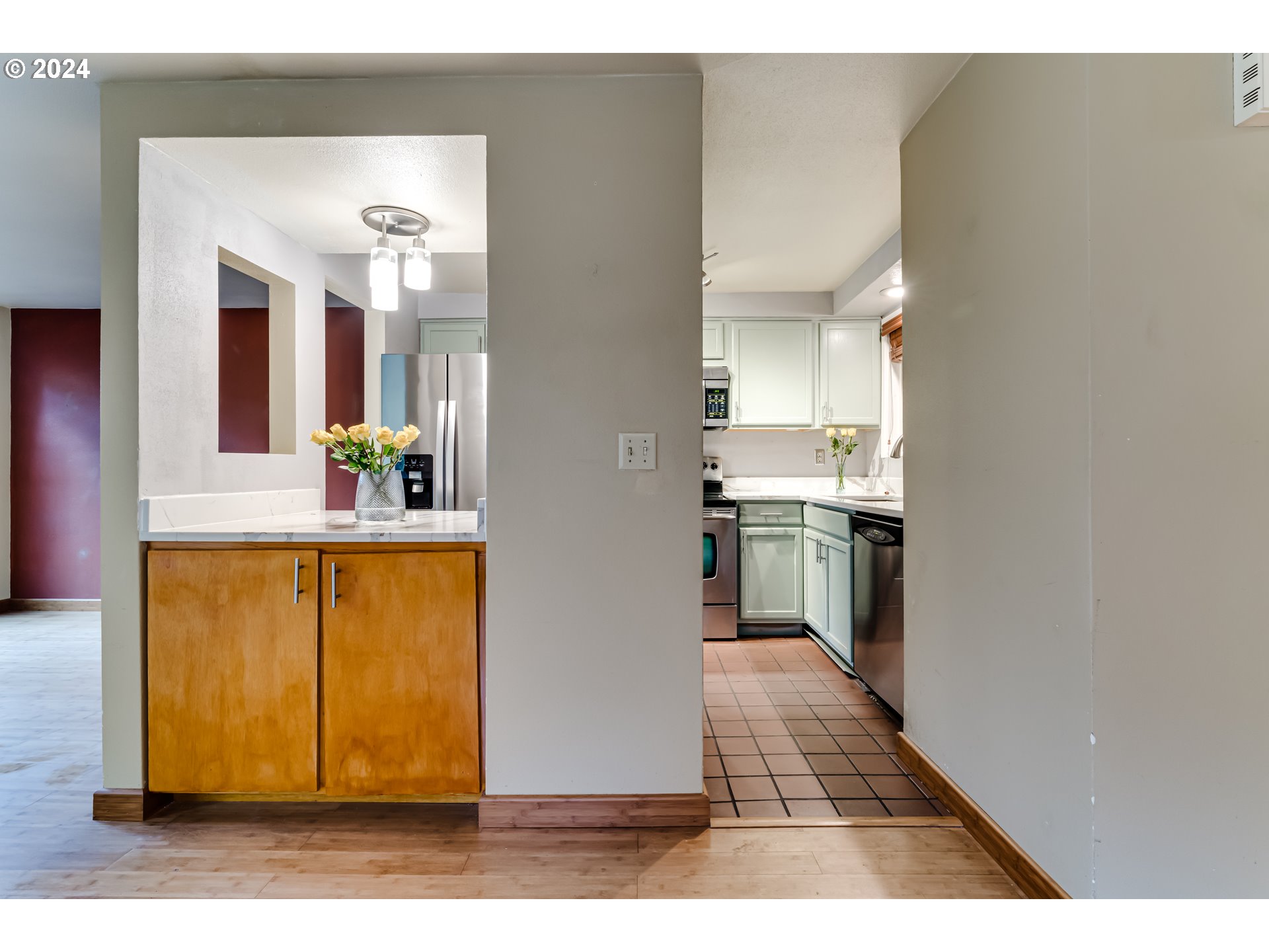 302 Woodcutter Way Eugene, OR 97405 - Photo 5 of 31 a open kitchen with granite countertop a sink and a stove top oven