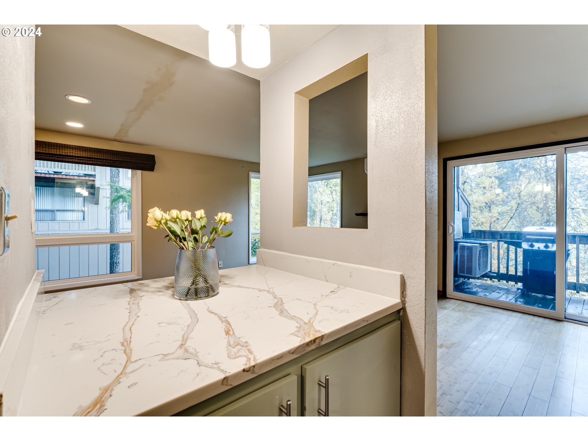 302 Woodcutter Way Eugene, OR 97405 - Photo 8 of 31 a view of kitchen with granite countertop cabinets and wooden floor