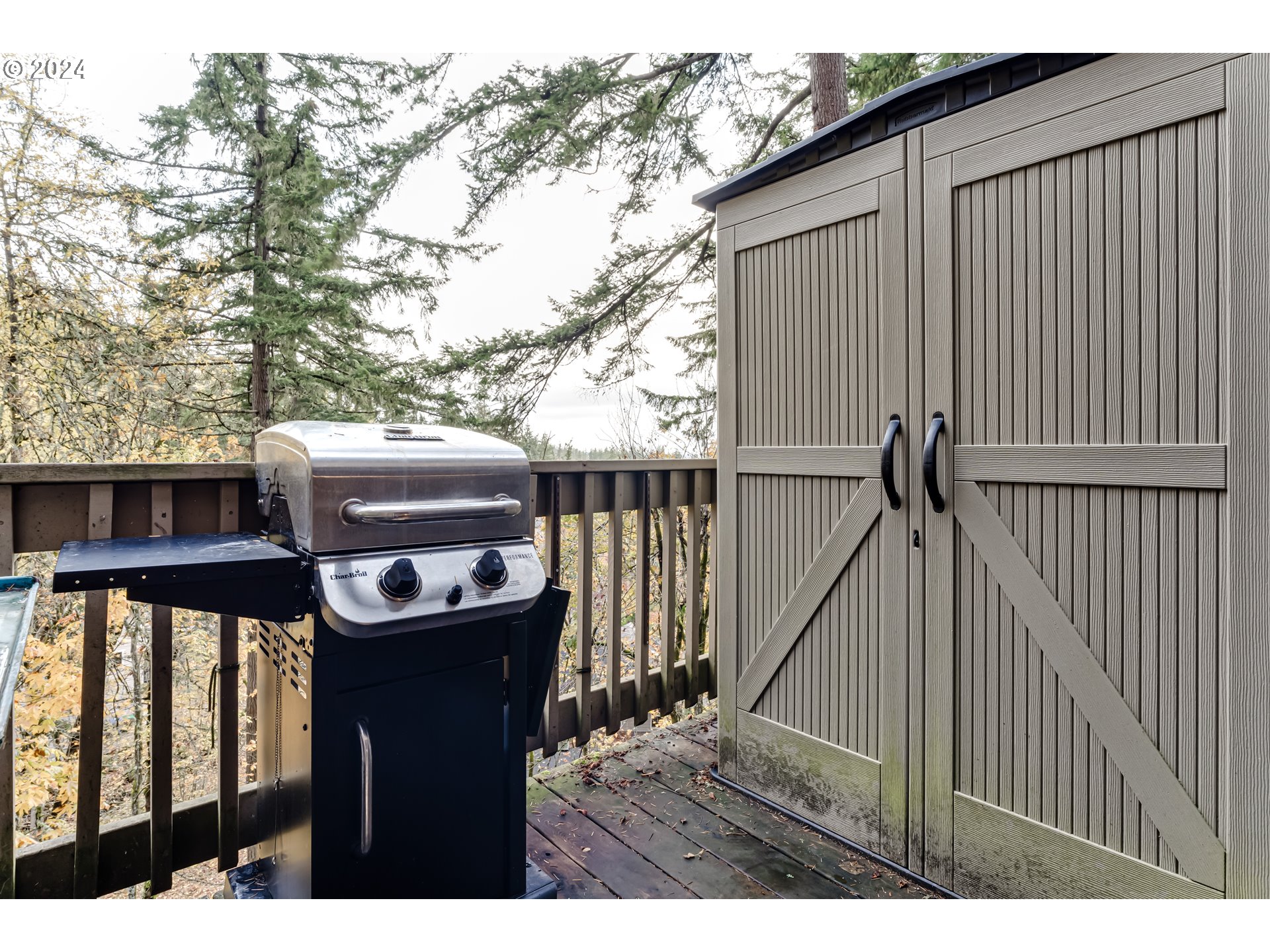 302 Woodcutter Way Eugene, OR 97405 - Photo 10 of 31 a view of a backyard with wooden fence