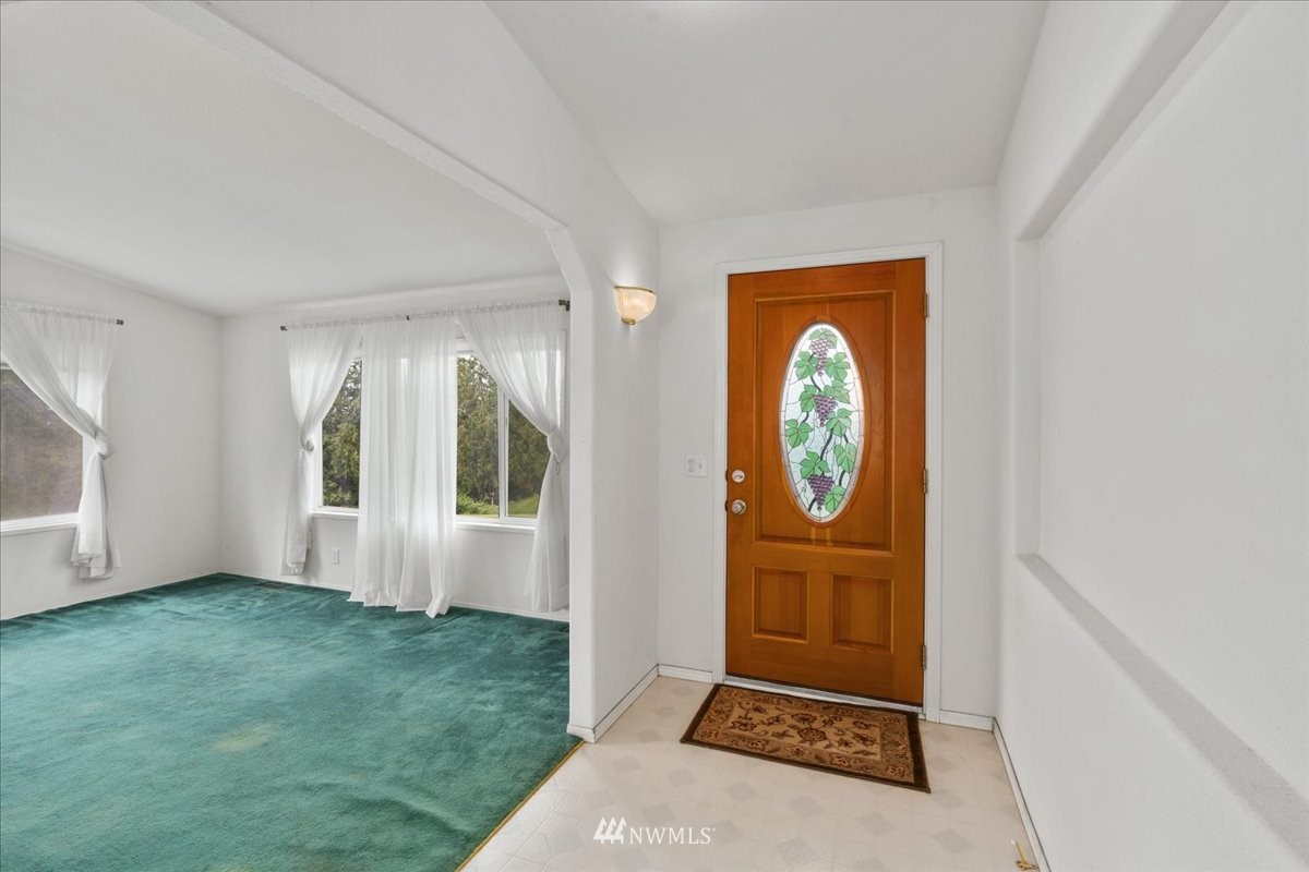 17455 Allen Road Bow, WA 98232 - Photo 15 of 33 a front view of a house with garden