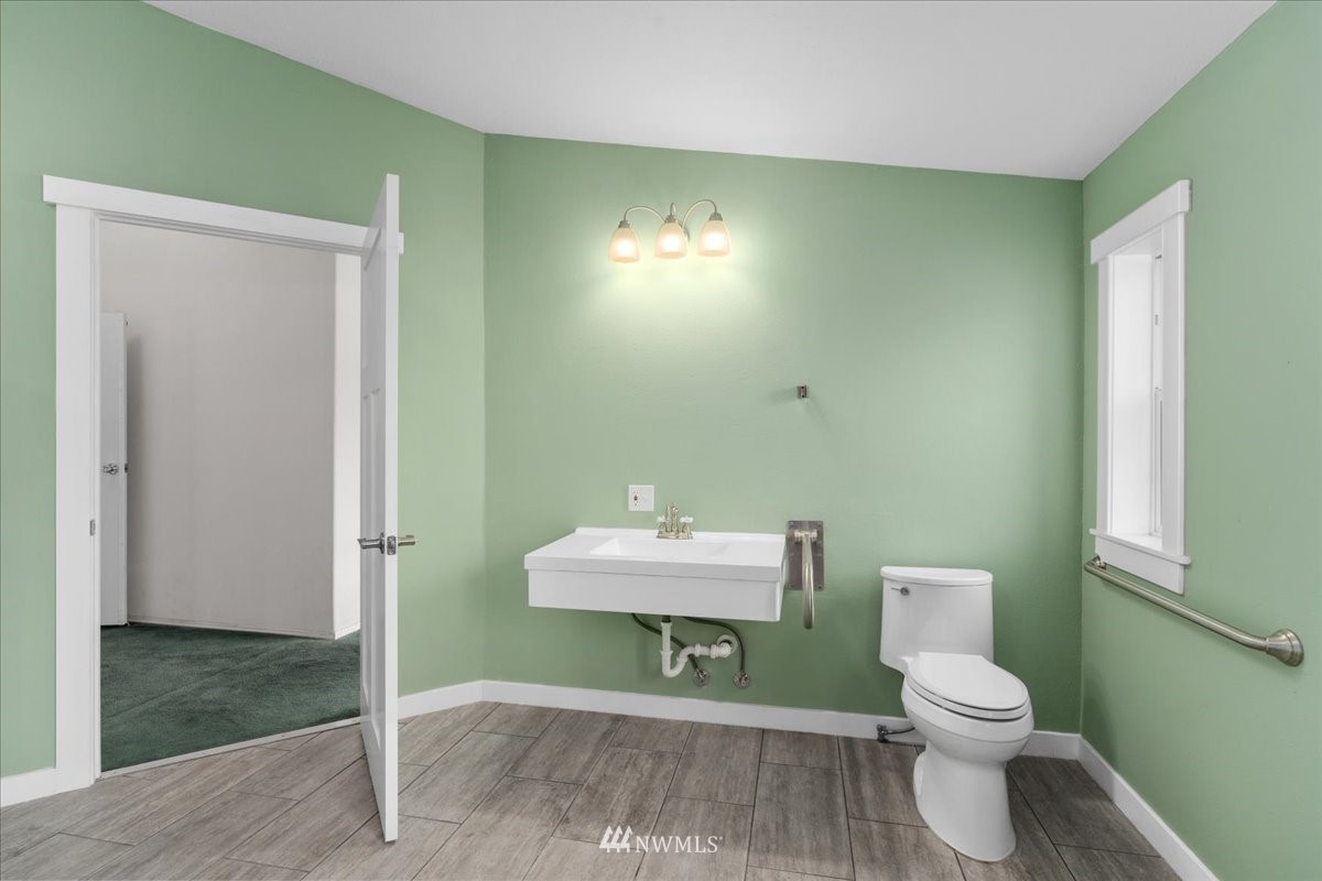 17455 Allen Road Bow, WA 98232 - Photo 19 of 33 a bathroom with a toilet a sink and mirror