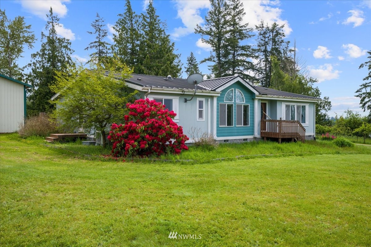 17455 Allen Road Bow, WA 98232 - Photo 2 of 33 a front view of a house with a garden