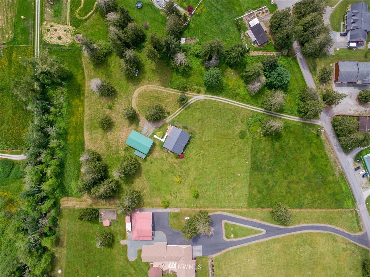 17455 Allen Road Bow, WA 98232 - Photo 33 of 33 an aerial view of a residential houses with yard and swimming pool
