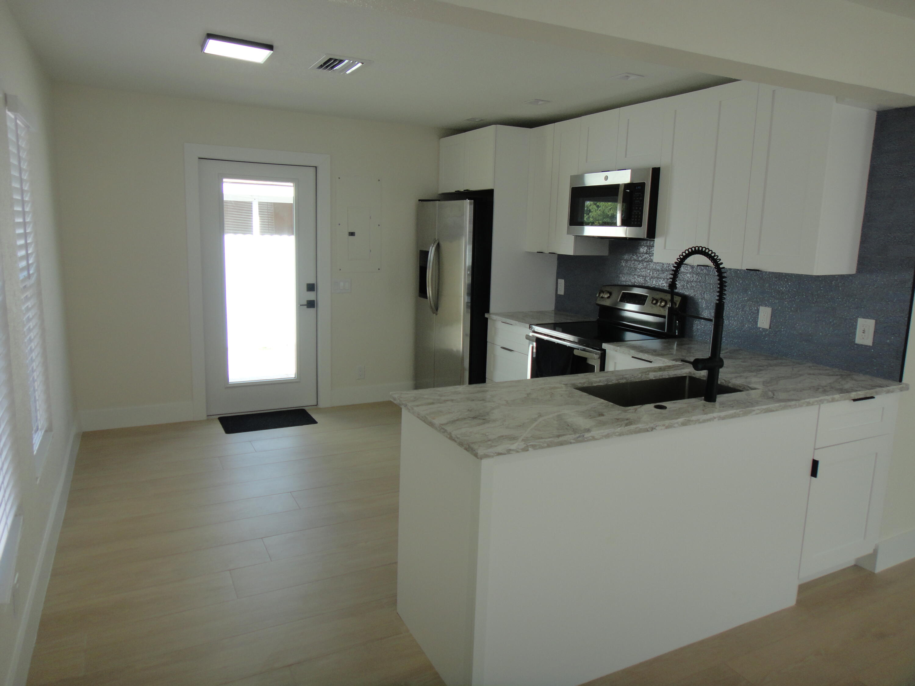 717 Bunker Road West Palm Beach, FL 33405 - Photo 3 of 9 KITCHEN-DINING