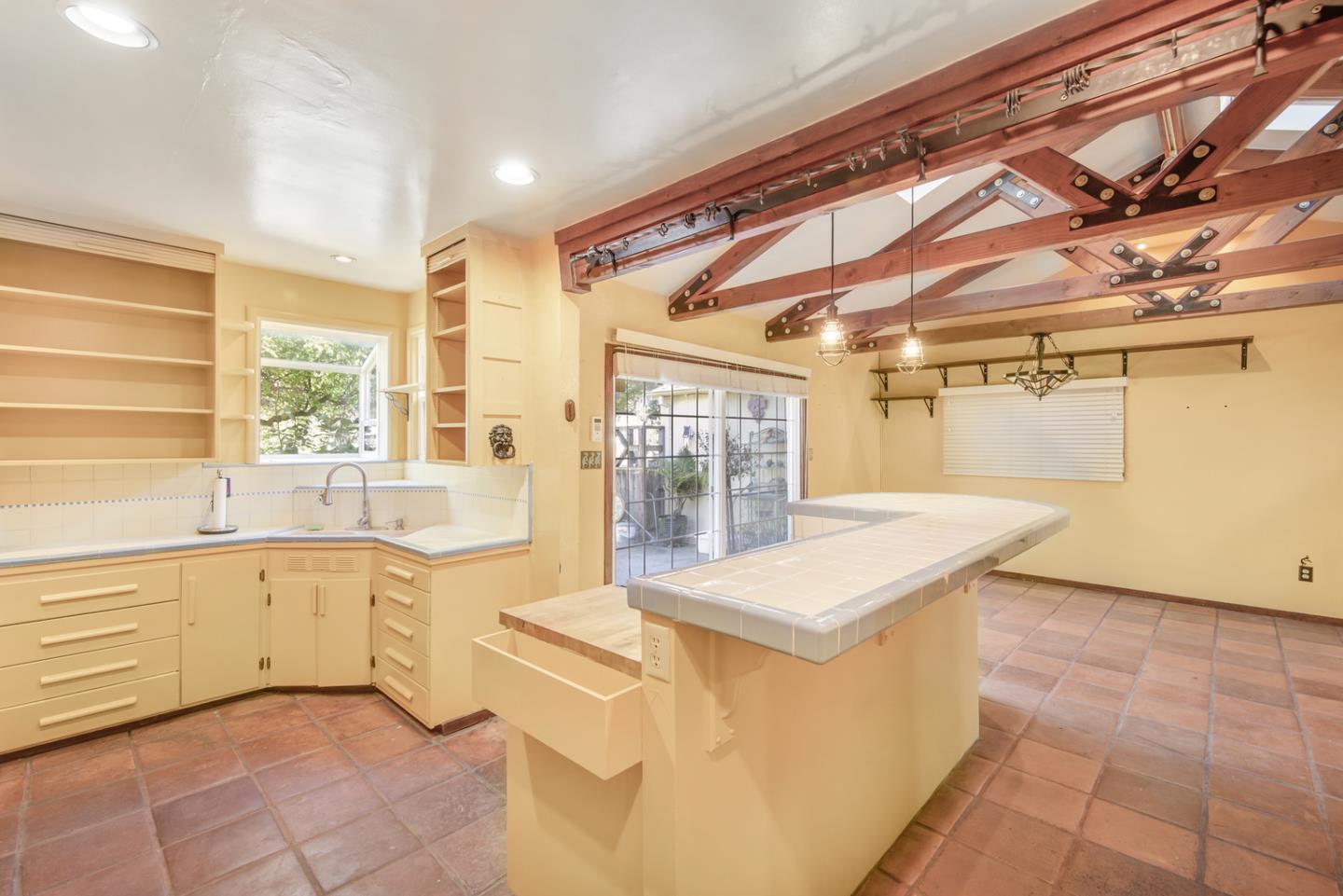 1265 Burrows Road Campbell, CA 95008 - Photo 11 of 32 a large white kitchen with a large window