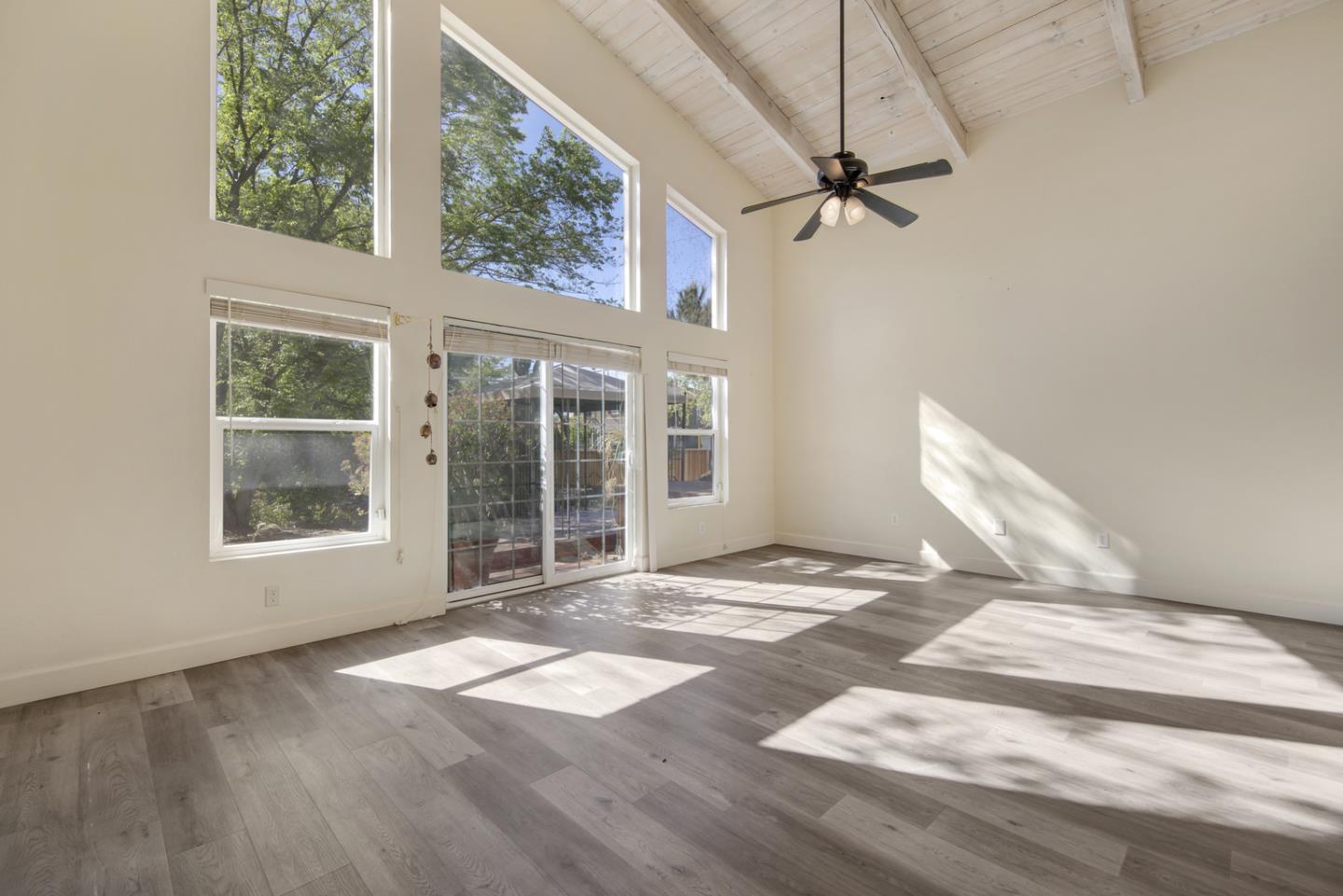 1265 Burrows Road Campbell, CA 95008 - Photo 15 of 32 a view of a bedroom with wooden floor and a window