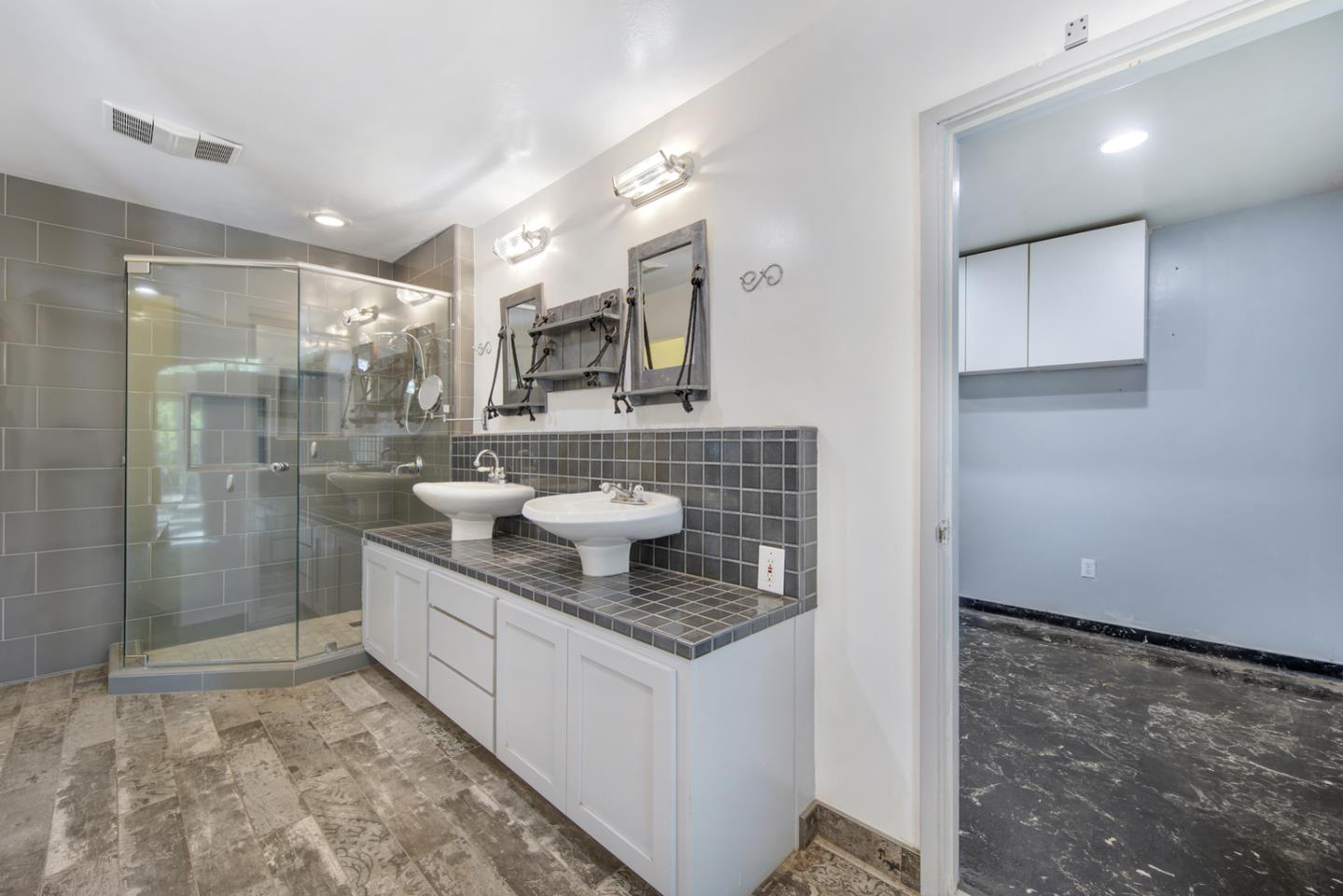 1265 Burrows Road Campbell, CA 95008 - Photo 17 of 32 a bathroom with a sink a toilet and shower