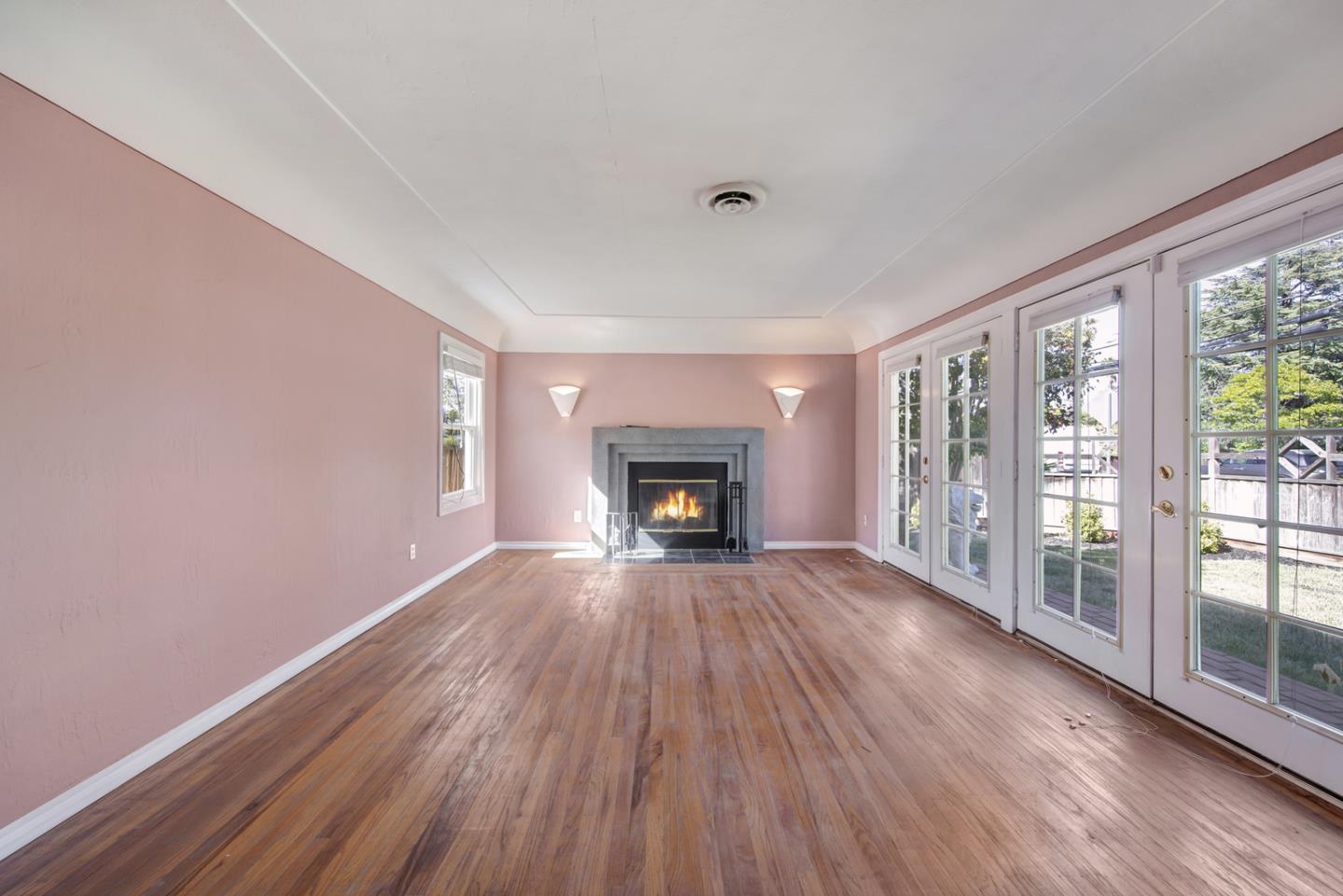 1265 Burrows Road Campbell, CA 95008 - Photo 6 of 32 a view of an empty room with wooden floor and a window