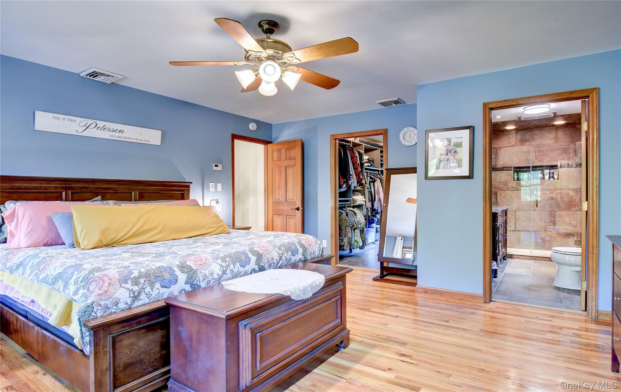 29 Valley View Road Bloomingburg, NY 12721 - Photo 23 of 50 a bedroom with a large bed and a chandelier