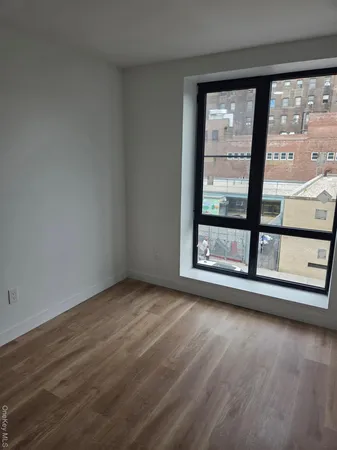 a kitchen with a sink a stove and cabinets