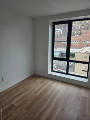 a kitchen with a sink a stove and cabinets
