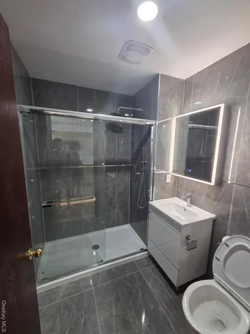 a kitchen with stainless steel appliances a sink stove and refrigerator