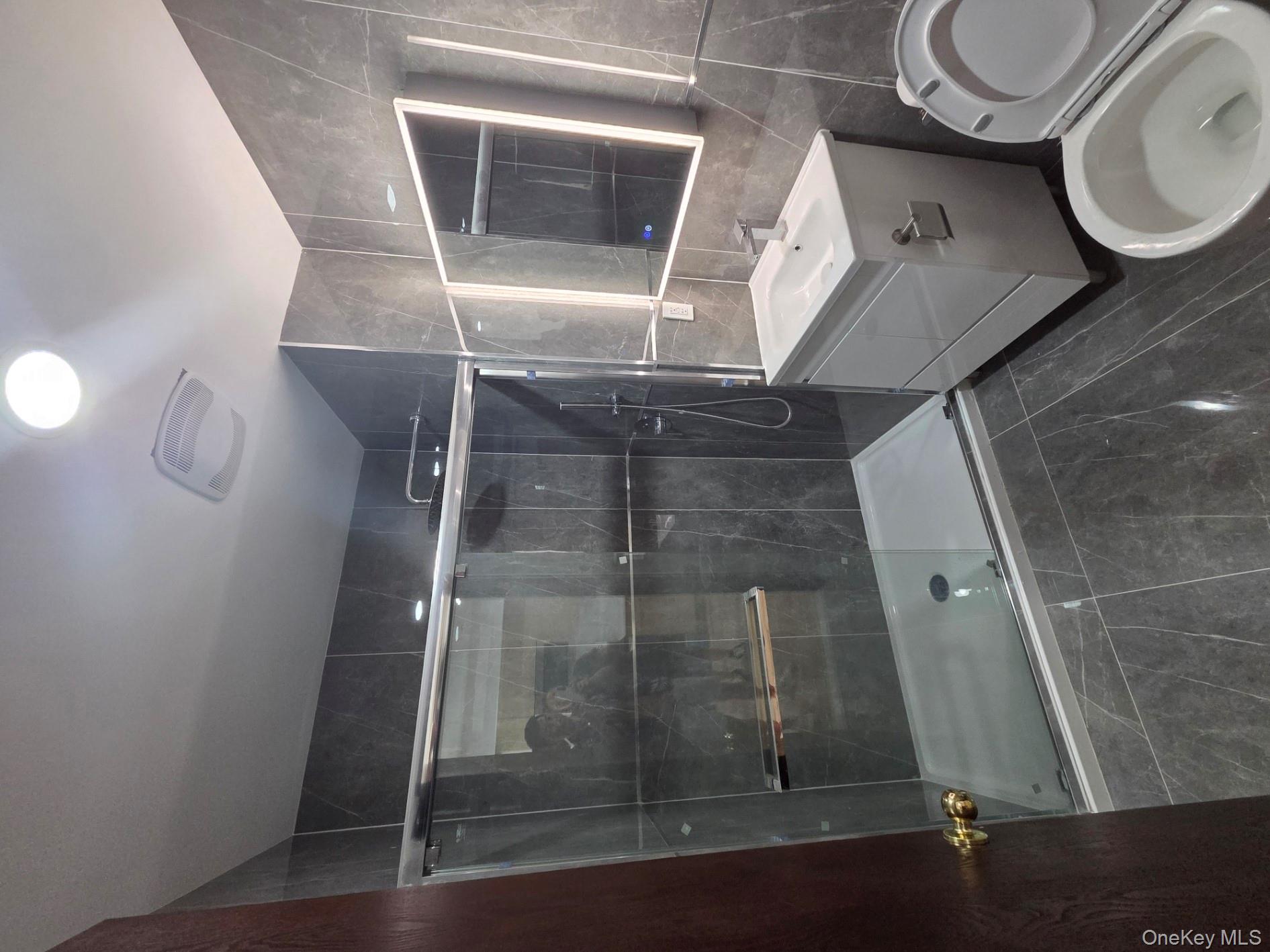 132 West 134th Street Manhattan, NY 10030 - Photo 7 of 15 a bathroom with a sink toilet and shower