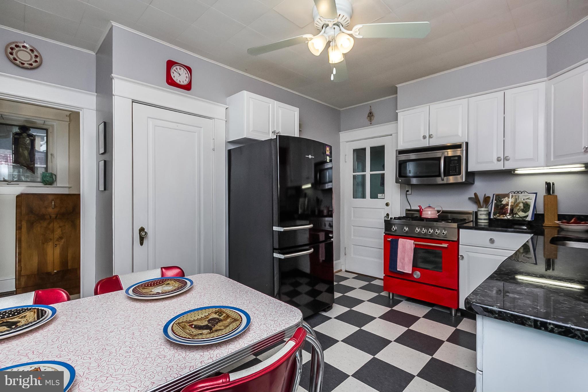 238 Ridgeway Road Baltimore, MD 21228 - Photo 16 of 30 a kitchen with refrigerator and stove top oven