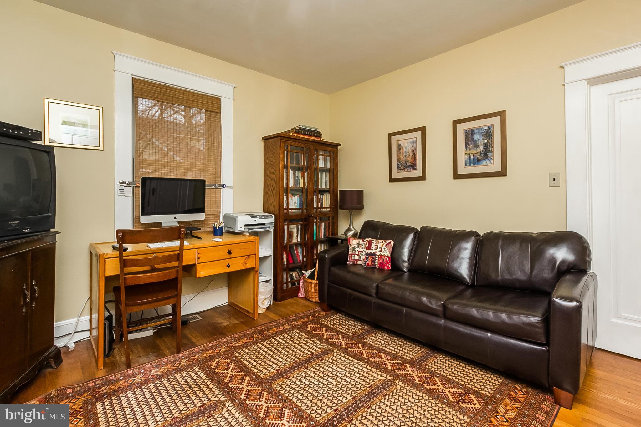 238 Ridgeway Road Baltimore, MD 21228 - Photo 17 of 30 a living room with furniture and a flat screen tv