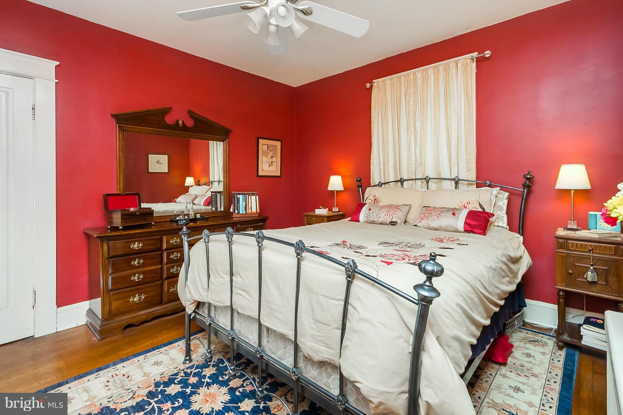 238 Ridgeway Road Baltimore, MD 21228 - Photo 22 of 30 a bedroom with bed and wooden floor