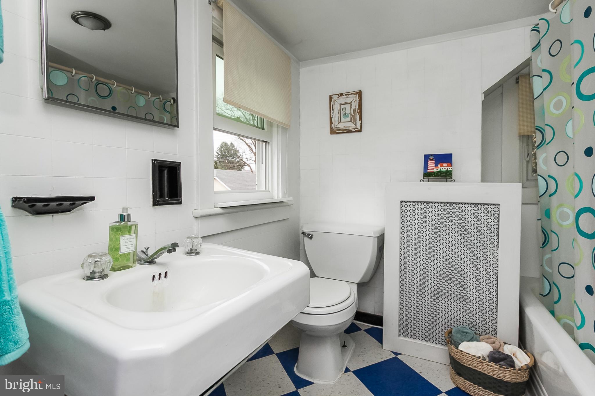 238 Ridgeway Road Baltimore, MD 21228 - Photo 26 of 30 a bathroom with a sink toilet and mirror