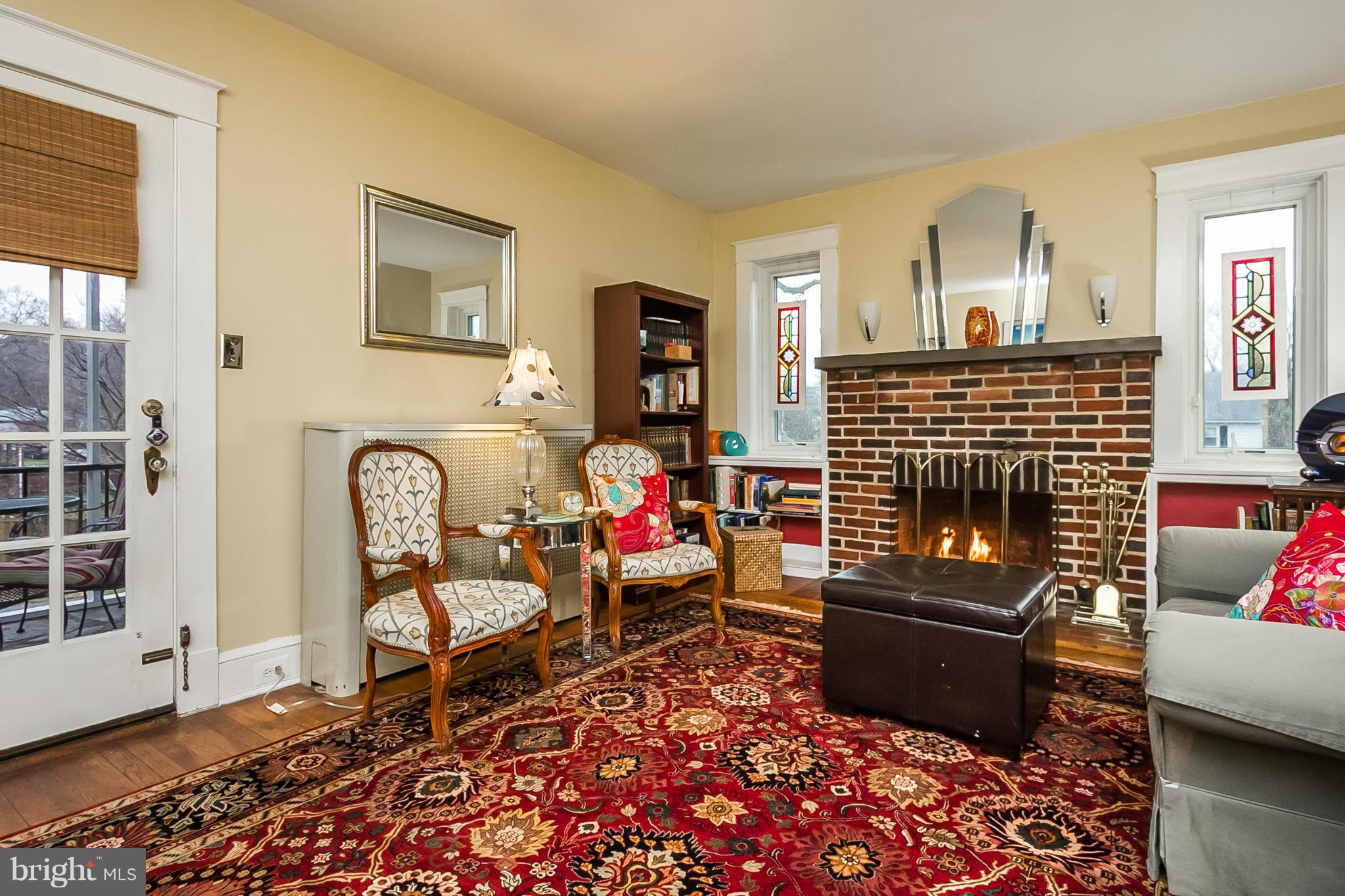 238 Ridgeway Road Baltimore, MD 21228 - Photo 4 of 30 a living room with furniture windows and a fireplace