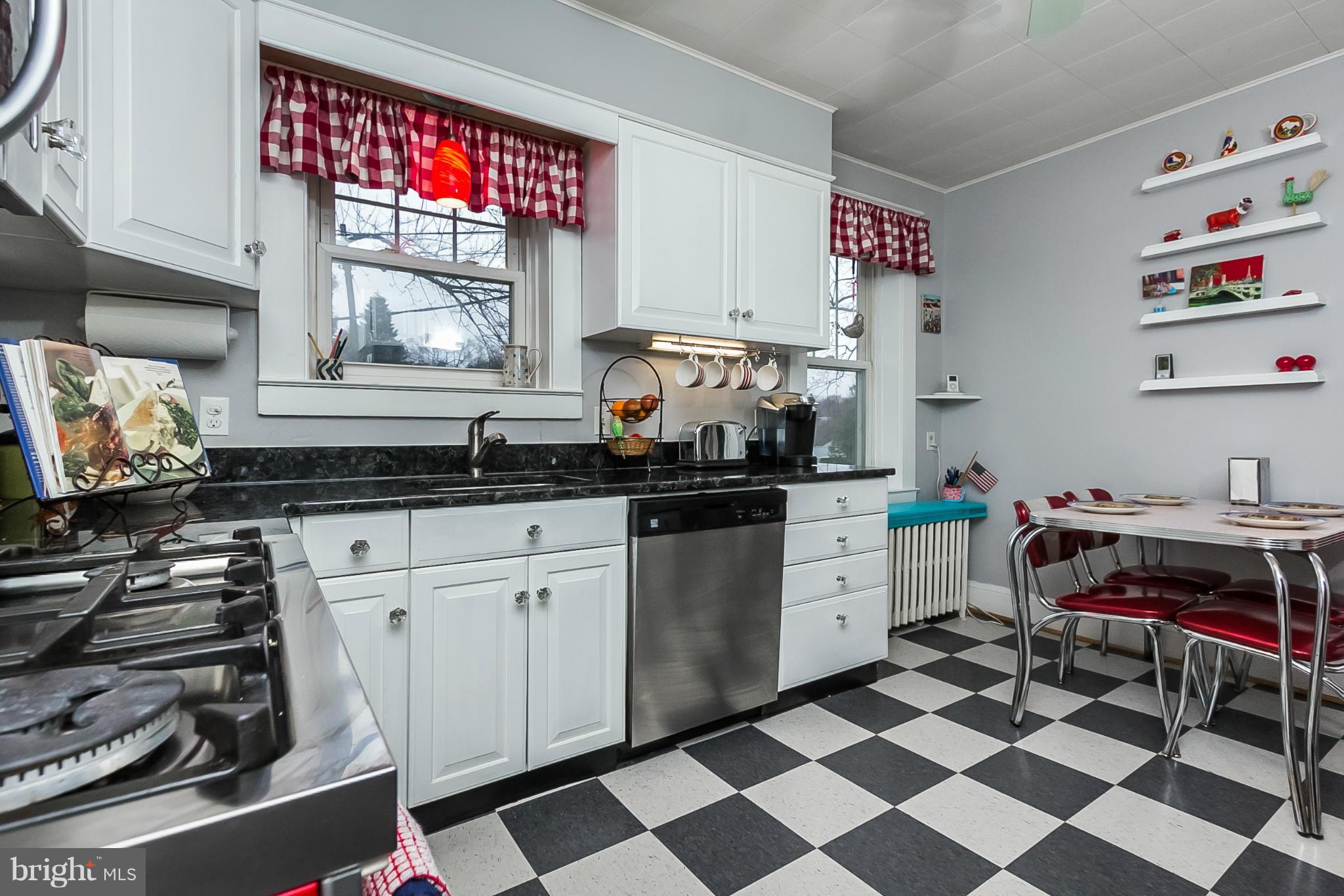 238 Ridgeway Road Baltimore, MD 21228 - Photo 9 of 30 a kitchen with a cabinets and window