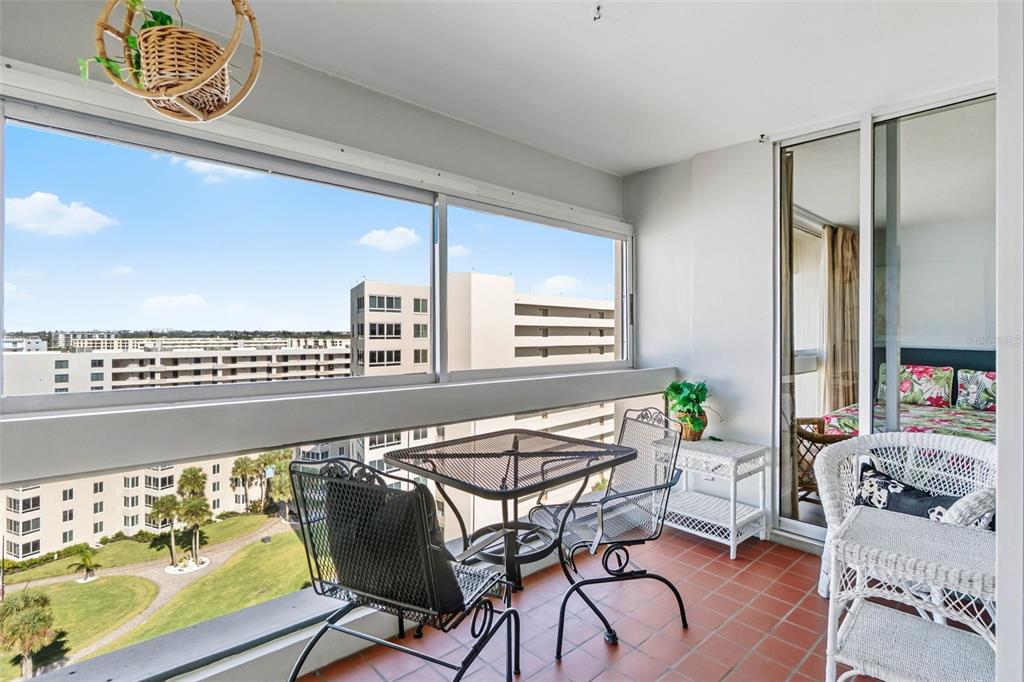 5966 Midnight Pass Road, Unit G113 Sarasota, FL 34242 - Photo 20 of 39 a living room with furniture and a large window