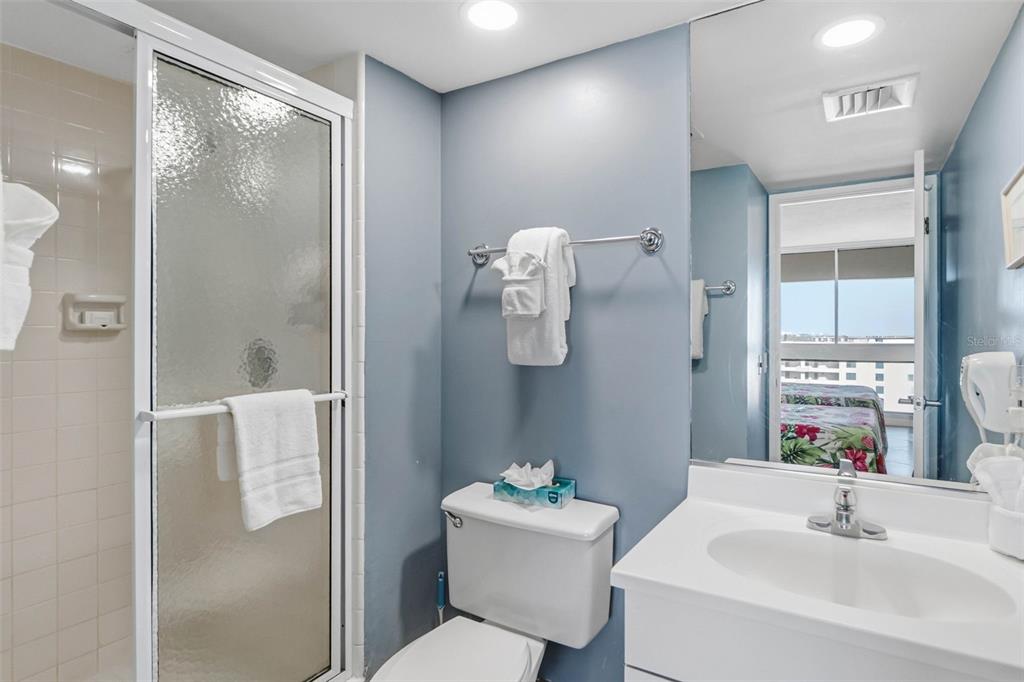 5966 Midnight Pass Road, Unit G113 Sarasota, FL 34242 - Photo 25 of 39 a bathroom with a sink toilet and shower