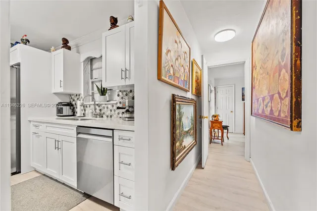 a bathroom with cabinets and a sink