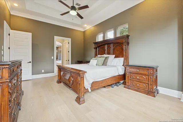 a living room with a large window and furniture