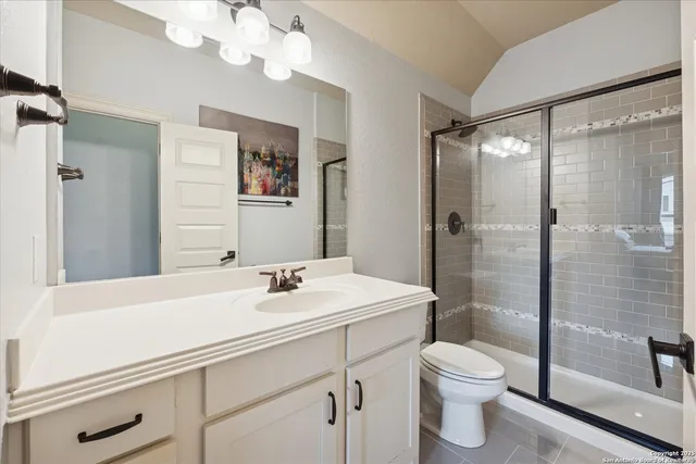 a view of a patio with table and chairs with wooden floor and fence