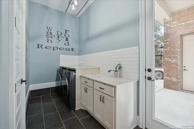 a front view of a brick house with a garage