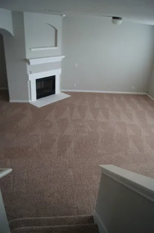 a view of empty room with windows